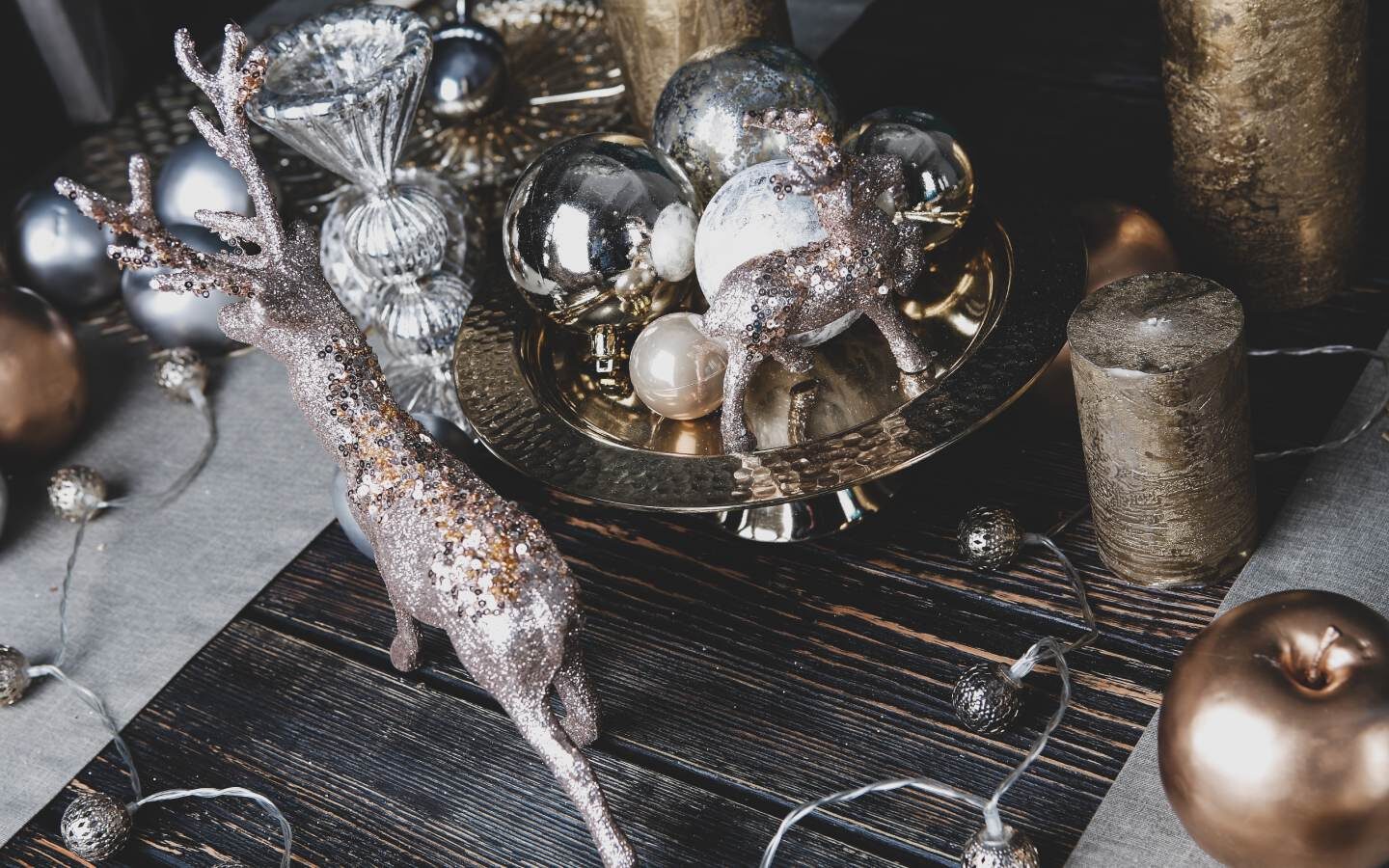 Table topped with Christmas lights and other decorating items