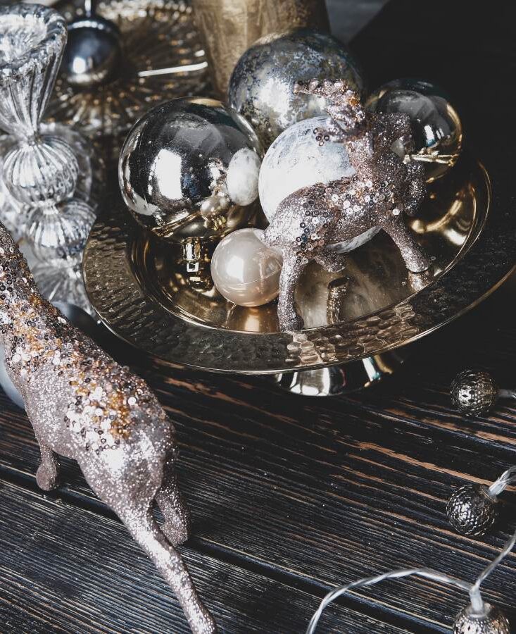 Table topped with Christmas lights and other decorating items